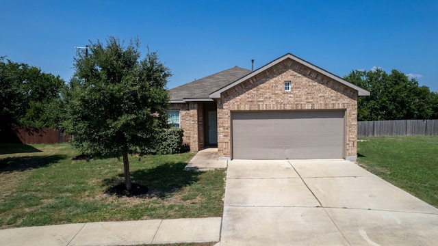 view of front of house featuring a garage and a front lawn