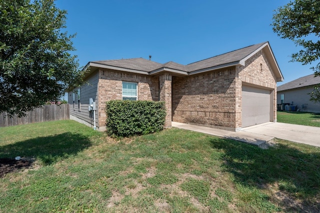 view of front of property with a garage and a front yard