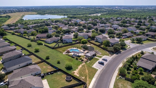 drone / aerial view featuring a residential view and a water view