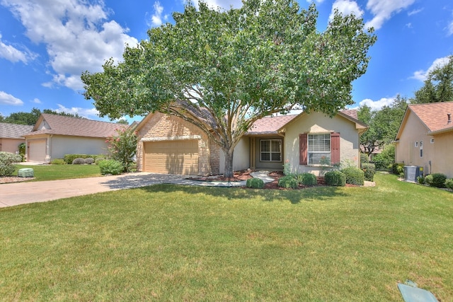 view of front of home featuring a front yard and a garage