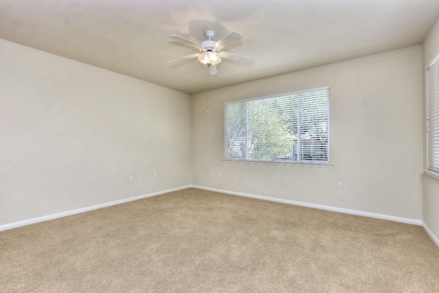 carpeted empty room with ceiling fan