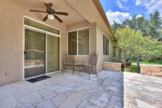 view of patio featuring ceiling fan