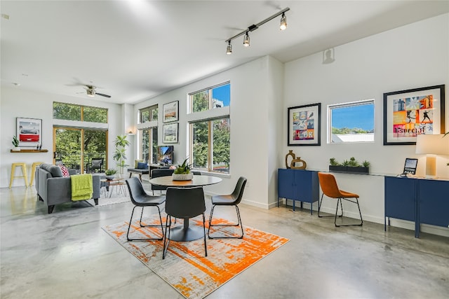 dining area featuring ceiling fan and track lighting