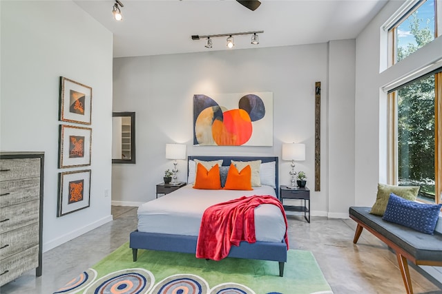 bedroom featuring track lighting