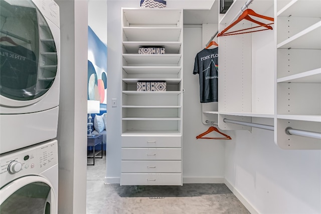 spacious closet featuring stacked washer and clothes dryer