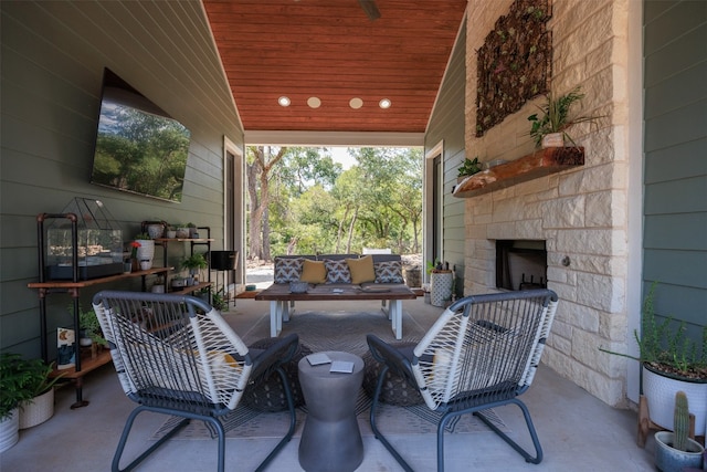 view of patio / terrace with an outdoor stone fireplace