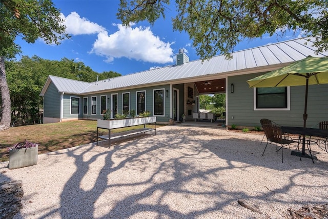 back of house featuring ceiling fan and a patio