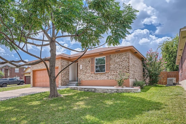 view of front facade featuring a front yard, a garage, and central AC unit