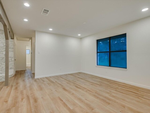 653 Leisure Ln, Cedar Creek, TX 78612 - empty room with light wood-style floors, recessed lighting, and baseboards