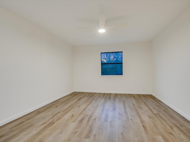 spare room featuring light wood-type flooring and ceiling fan