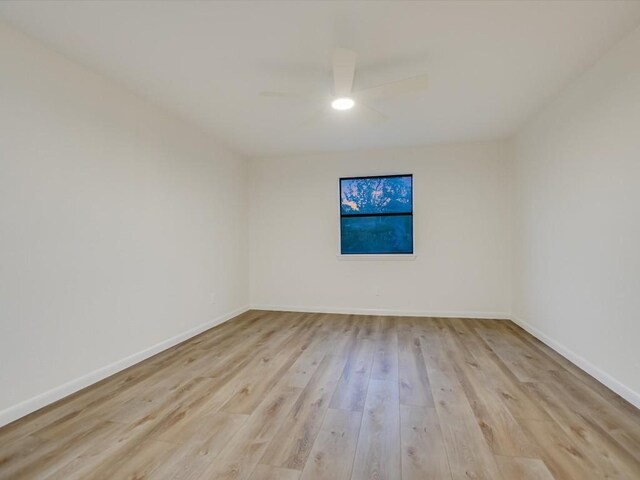 653 Leisure Ln, Cedar Creek, TX 78612 - unfurnished room with a ceiling fan, light wood-style floors, and baseboards
