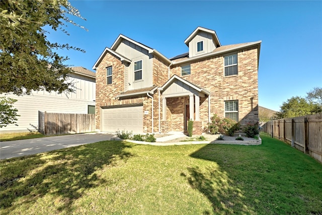 view of front of property featuring a garage and a front lawn