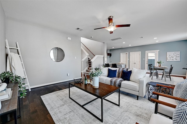 living room featuring dark hardwood / wood-style floors and ceiling fan