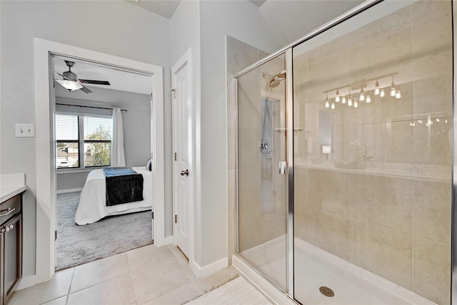 bathroom featuring walk in shower, tile patterned floors, ceiling fan, and vanity