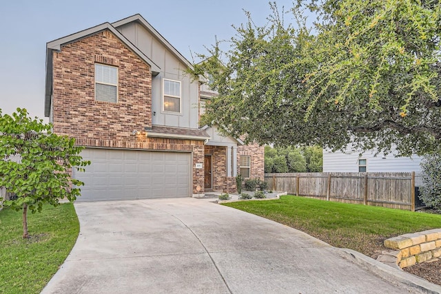 view of front of house with a garage and a front yard