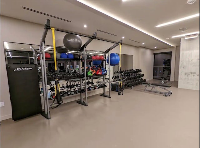 exercise room with concrete floors