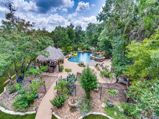 view of pool featuring a gazebo, an in ground hot tub, and a patio