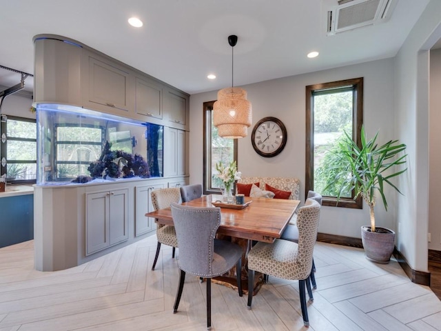 dining space with light parquet floors