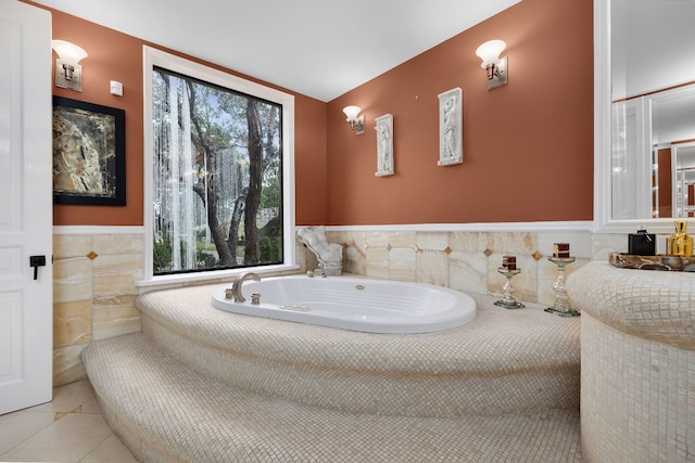 bathroom featuring tile walls, tiled tub, and tile patterned floors