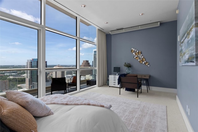 carpeted bedroom featuring multiple windows and a wall of windows