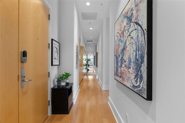 hall with light wood-type flooring