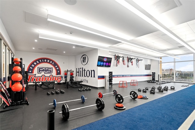 gym featuring floor to ceiling windows