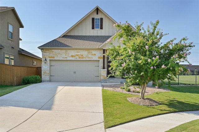 view of front facade featuring a front yard and a garage