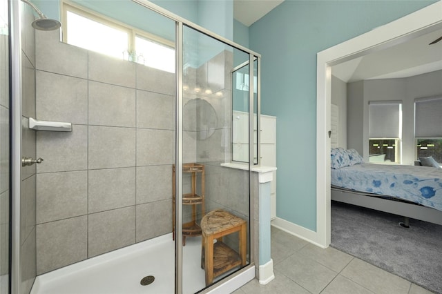 bathroom featuring tile patterned floors and an enclosed shower