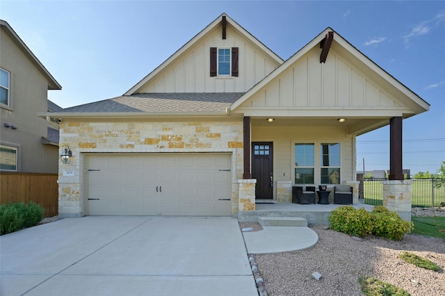 view of front of house featuring a porch and a garage