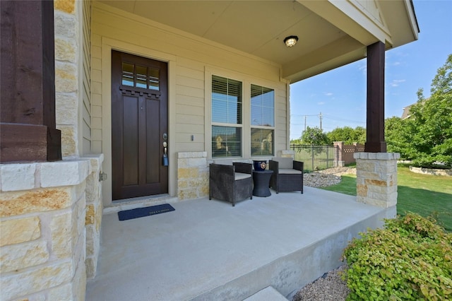 doorway to property featuring covered porch