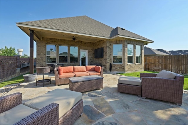 view of patio featuring an outdoor living space and ceiling fan