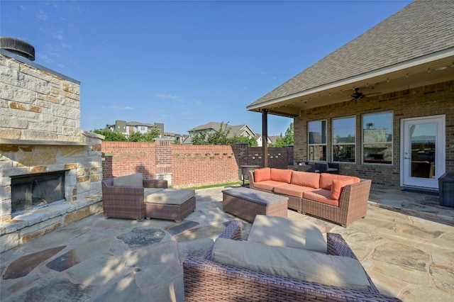 view of patio / terrace featuring an outdoor living space with a fireplace