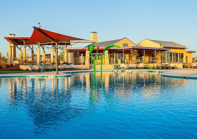 view of pool featuring a patio area