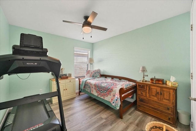 bedroom featuring hardwood / wood-style flooring and ceiling fan