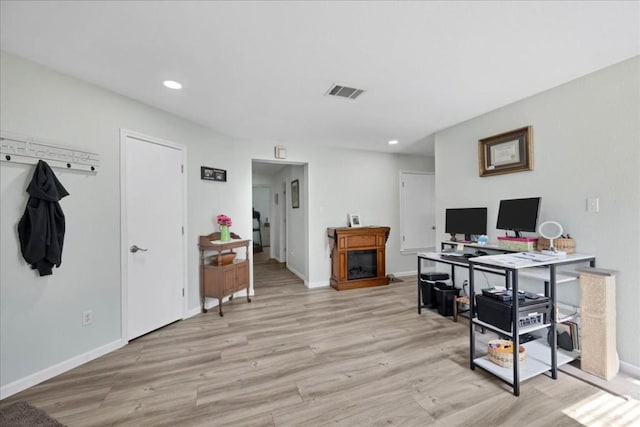 office space with light wood-type flooring