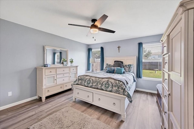 bedroom with hardwood / wood-style floors and ceiling fan