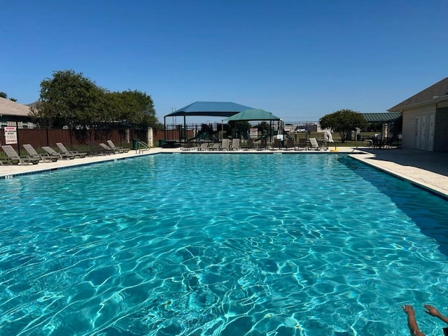 view of swimming pool featuring a patio area