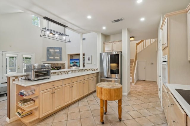 617 Evergreen Ln, New Braunfels, TX 78130 - kitchen featuring smart refrigerator, light brown cabinets, light countertops, and recessed lighting