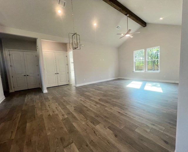 unfurnished living room with ceiling fan with notable chandelier, beam ceiling, high vaulted ceiling, and dark hardwood / wood-style flooring