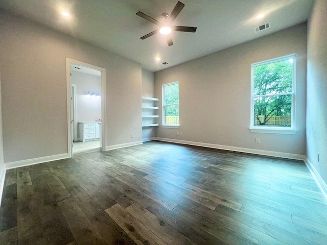 unfurnished room featuring ceiling fan and dark hardwood / wood-style floors