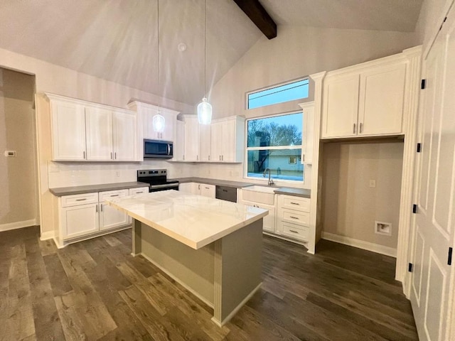 kitchen featuring dark wood finished floors, a kitchen island, appliances with stainless steel finishes, white cabinetry, and pendant lighting