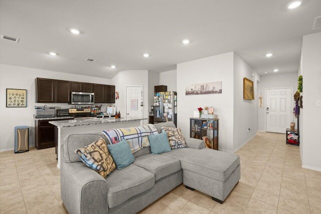 living room with light tile patterned floors