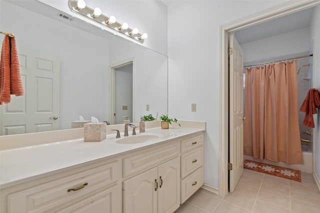 bathroom with vanity, shower / bath combination with curtain, and tile patterned flooring