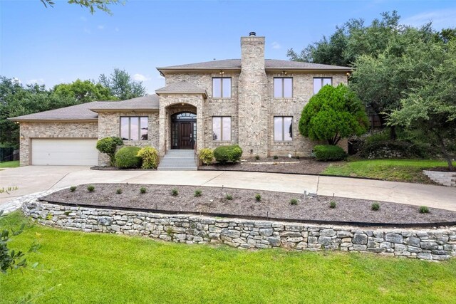 5913 Doone Valley Ct, Austin, TX 78731 - view of front of property with concrete driveway, a chimney, and a front yard