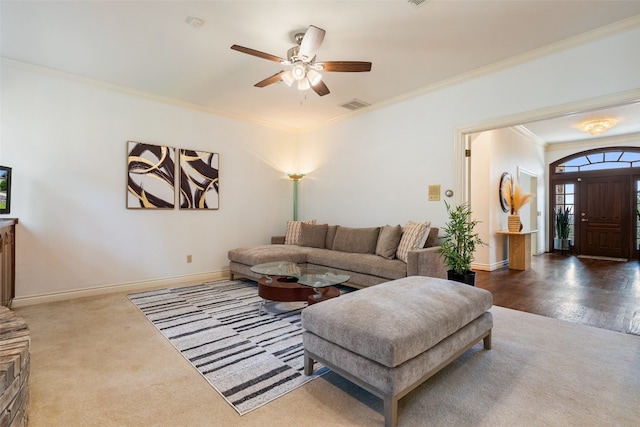 living room with crown molding, hardwood / wood-style flooring, and ceiling fan