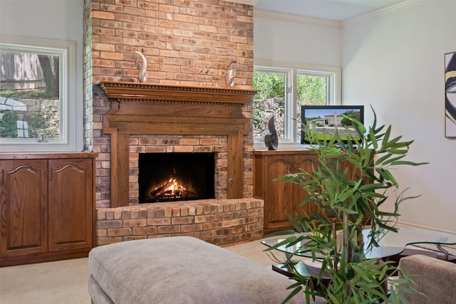 carpeted living room featuring ornamental molding and a brick fireplace