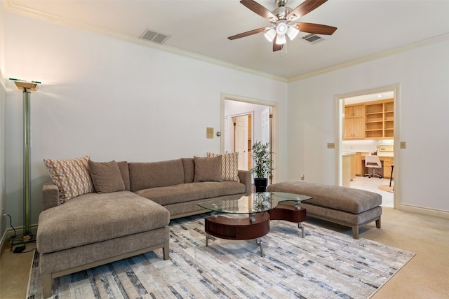 carpeted living room with crown molding and ceiling fan