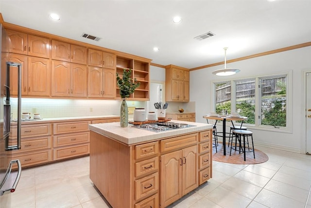 5913 Doone Valley Ct, Austin, TX 78731 - kitchen with tile counters, open shelves, stainless steel gas stovetop, light tile patterned floors, and ornamental molding
