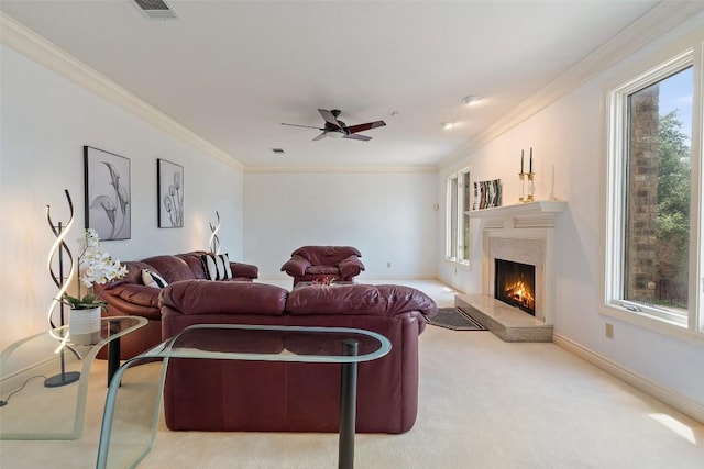 5913 Doone Valley Ct, Austin, TX 78731 - carpeted living room with a high end fireplace, crown molding, and a ceiling fan