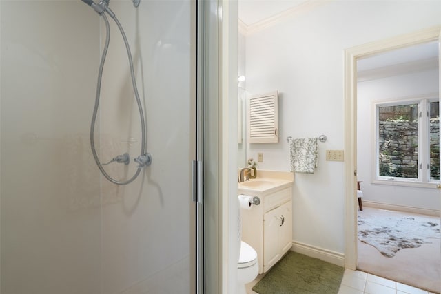 bathroom featuring vanity, crown molding, toilet, tile patterned floors, and a shower